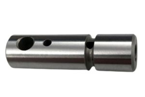 Precision machined metal component with holes, used in manufacturing and engineering applications.